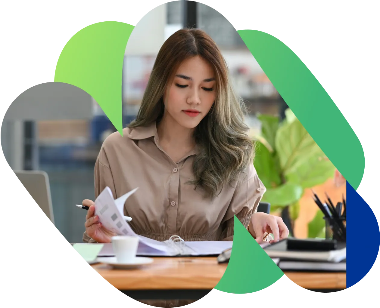 An agency owner working through a stack of invoices.